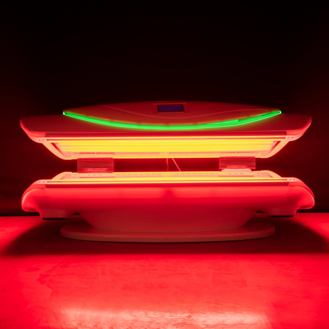 Red light therapy device with illuminated panels, showcasing advanced technology for recovery and skin health, featured in a wellness context.