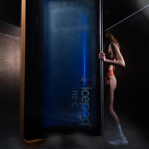 Cryotherapy pod with user preparing for treatment at -110 °C, showcasing Ember & Ice's next-generation Icepod design for wellness and recovery.